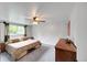 Spacious main bedroom with a ceiling fan, plush carpet, and ample natural light at 10462 Hoyt St, Westminster, CO 80021