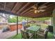 Relaxing covered patio with a hot tub and dining area, perfect for outdoor enjoyment at 10462 Hoyt St, Westminster, CO 80021