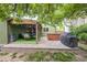 Back patio area featuring a hot tub and outdoor dining, perfect for entertaining and relaxation at 10462 Hoyt St, Westminster, CO 80021