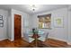 Bright breakfast nook with hardwood floors and a round glass table perfect for intimate dining at 760 Niagara St, Denver, CO 80220