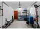 Organized garage space with ample storage, epoxy flooring, and functional layout for vehicles and equipment at 760 Niagara St, Denver, CO 80220