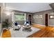 Spacious living room with hardwood floors, contemporary decor, and abundant natural light from the window at 760 Niagara St, Denver, CO 80220