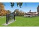 Scenic view of Montclair Park, including the green space and an elegant historic building at 760 Niagara St, Denver, CO 80220