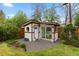 Backyard shed with a garden and large windows at 760 Niagara St, Denver, CO 80220