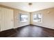 Bright living room featuring hardwood floors and ample natural light, creating a welcoming atmosphere at 5185 Alcott St, Denver, CO 80221