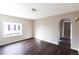 Cozy living room with hardwood floors, neutral walls, and natural light creating a relaxing ambiance at 5185 Alcott St, Denver, CO 80221