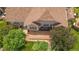 Backyard aerial view featuring a brick patio and beautiful landscaping on a well maintained home at 3494 S Otis Ct, Lakewood, CO 80227
