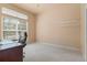Clean bedroom with carpet, large window and office desk set at 3494 S Otis Ct, Lakewood, CO 80227