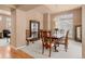 Dining space with wood table set and hutch plus carpet flooring at 3494 S Otis Ct, Lakewood, CO 80227