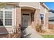 Close up of brick front entrance with decorative trimmed door at 3494 S Otis Ct, Lakewood, CO 80227