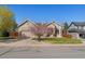 Charming single-Gathering home with well-maintained landscaping and a two-car garage at 3494 S Otis Ct, Lakewood, CO 80227