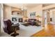 Inviting living room with plush seating, fireplace, and elegant decor at 3494 S Otis Ct, Lakewood, CO 80227