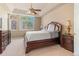 Spacious main bedroom with trey ceilings, a large window, and tasteful decor, creating a serene retreat at 3494 S Otis Ct, Lakewood, CO 80227