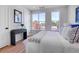 Bright bedroom boasts natural light, a modern console table, and a serene aesthetic at 5142 W 44Th Ave, Denver, CO 80212