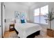 Bright bedroom showcasing a comfortable bed, fresh white walls, and ample natural light at 5142 W 44Th Ave, Denver, CO 80212