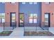 Modern townhome exterior showcasing brick and siding details, with inviting front entrances and landscaping at 5142 W 44Th Ave, Denver, CO 80212