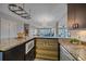 Modern kitchen with granite countertops, stainless steel appliances, and open layout at 800 N Washington St # 706, Denver, CO 80203