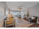 Inviting living room featuring a plush sofa, area rug, and view to sunroom at 800 N Washington St # 706, Denver, CO 80203