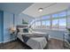 Sun-filled bedroom with large windows offering city views and stylish decor, creating a serene atmosphere at 800 N Washington St # 706, Denver, CO 80203