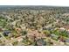 Aerial view of a home in a tranquil neighborhood, surrounded by lush trees and well-maintained landscapes, offering a serene setting at 7106 S Kendall Blvd, Littleton, CO 80128