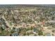 An aerial view captures a quiet, residential neighborhood with mature trees, well-kept homes, and a sense of community at 7106 S Kendall Blvd, Littleton, CO 80128