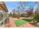 Serene backyard with a beautiful patio, lush greenery, and a peaceful atmosphere at 7106 S Kendall Blvd, Littleton, CO 80128