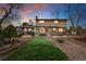 Expansive backyard showcasing a well-maintained lawn and mature trees at 7106 S Kendall Blvd, Littleton, CO 80128