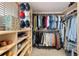 Spacious walk-in closet with custom shelving and ample storage space at 7106 S Kendall Blvd, Littleton, CO 80128
