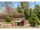 Cozy backyard fire pit area with seating, offering a perfect spot for gatherings and enjoying outdoor evenings at 7106 S Kendall Blvd, Littleton, CO 80128