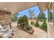 Inviting front porch featuring well-kept landscaping and a brick accent wall at 7106 S Kendall Blvd, Littleton, CO 80128