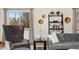 Comfortable living room with a neutral color palette, large windows, and stylish decor at 7106 S Kendall Blvd, Littleton, CO 80128