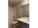 Standard bathroom with a toilet, vanity and shower/tub at 1783 Jennifer St, Brighton, CO 80601