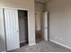 Bedroom features plush carpeting and a closet for ample storage at 1783 Jennifer St, Brighton, CO 80601