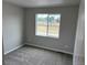 Bedroom featuring plush carpeting and natural lighting at 1783 Jennifer St, Brighton, CO 80601