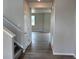 Entryway leading to living area featuring durable plank flooring at 1783 Jennifer St, Brighton, CO 80601