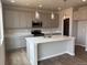 Kitchen featuring an island, pendant lighting, stainless steel appliances, and plenty of cabinet space at 1783 Jennifer St, Brighton, CO 80601