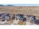 This aerial view showcases the home's setting with solar panels, landscaping, and mountain views at 17829 W 95Th Pl, Arvada, CO 80007