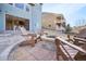 Backyard patio with comfortable outdoor seating and a cozy fire pit, perfect for entertaining at 17829 W 95Th Pl, Arvada, CO 80007