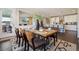Open-concept dining room with a direct view of the kitchen and a pass-through to another living space at 17829 W 95Th Pl, Arvada, CO 80007