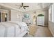 Spacious main bedroom with luxurious bed, stylish dressers, and bright lighting at 17829 W 95Th Pl, Arvada, CO 80007