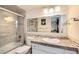 Updated bathroom with granite countertop and glass shower at 3855 S Monaco St # 170, Denver, CO 80237