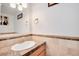 Updated bathroom vanity with granite countertop and tile at 3855 S Monaco St # 170, Denver, CO 80237