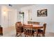 Bright dining area with a round wooden table and chairs at 3855 S Monaco St # 170, Denver, CO 80237