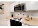 Modern kitchen with stainless steel appliances and gas range at 3855 S Monaco St # 170, Denver, CO 80237