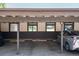 Covered parking area with designated parking spots and ample overhead cover at 3855 S Monaco St # 170, Denver, CO 80237