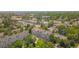 Aerial view showcases the neighborhood with tree lined streets and nearby shopping area at 6382 W Byers Pl, Lakewood, CO 80226