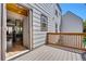 Exterior view of the back deck and the open doorway to the kitchen at 6382 W Byers Pl, Lakewood, CO 80226