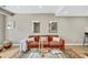 Cozy living room with modern furniture, stylish decor, and lots of natural light at 6382 W Byers Pl, Lakewood, CO 80226