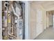 Utilities with a water heater and furnace are located in the finished portion of the garage at 6382 W Byers Pl, Lakewood, CO 80226