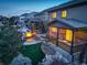 Aerial view of home at dusk with lit windows at 13717 Ashgrove Cir, Parker, CO 80134